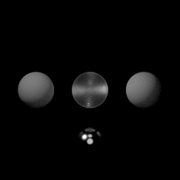 Four spheres lit by multiple point light sources, with the bottom metallic sphere realistically reflecting the other spheres and light sources